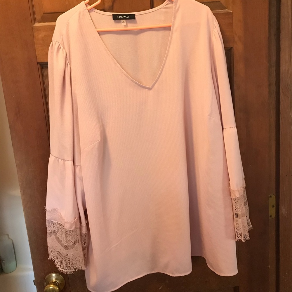 Light pink blouse with lace bell arms